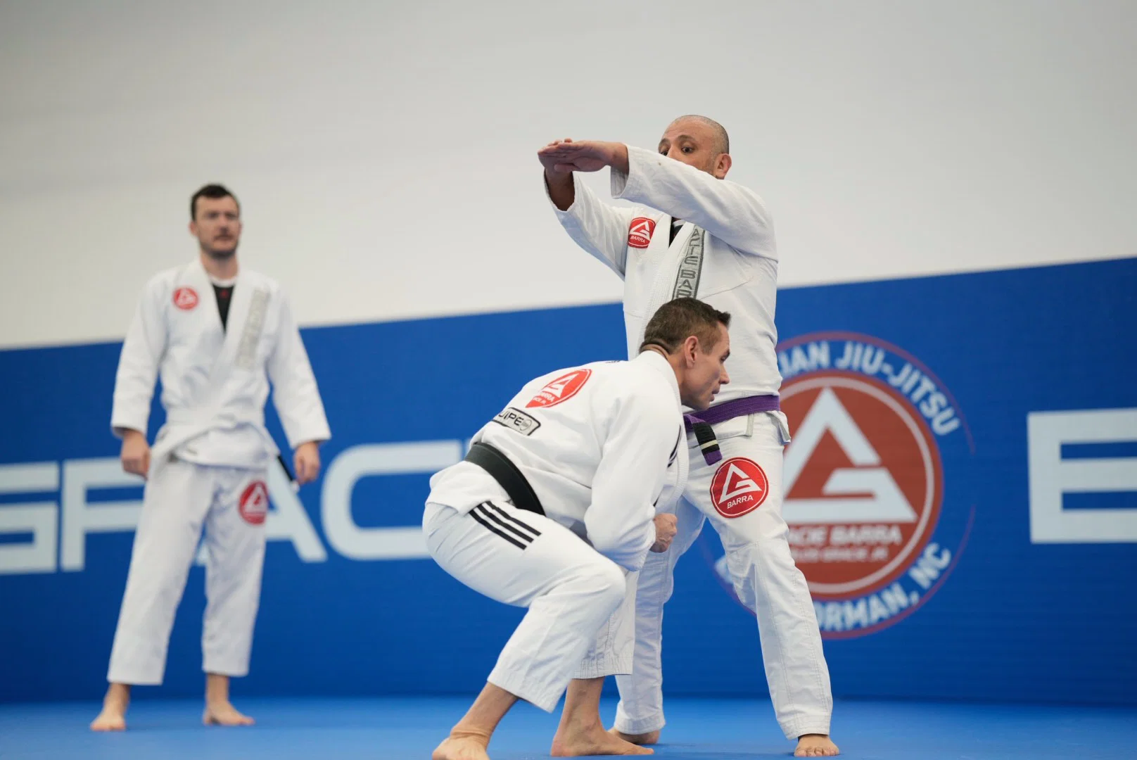 Students training Brazilian Jiu-Jitsu techniques at Gracie Barra Lake Norman school